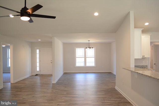 entrance foyer featuring recessed lighting, baseboards, and wood finished floors