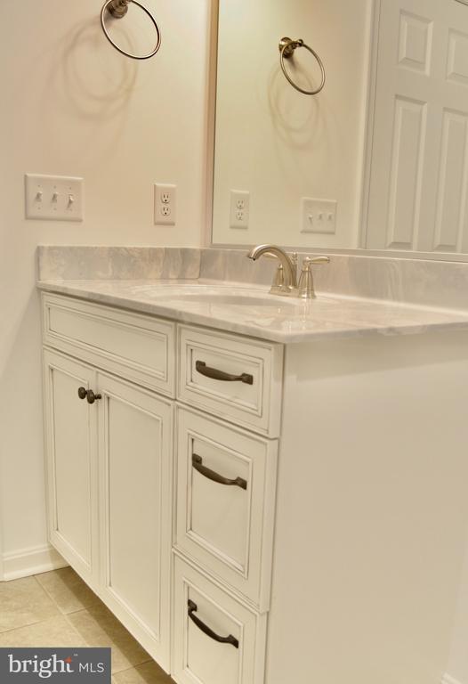 bathroom with vanity and tile patterned floors