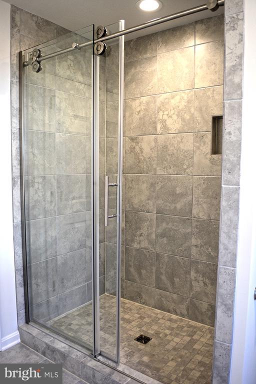 bathroom featuring a stall shower