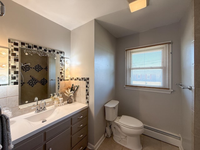 full bath with vanity, a tile shower, tile patterned flooring, toilet, and baseboard heating