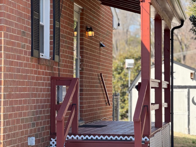 view of side of home with brick siding