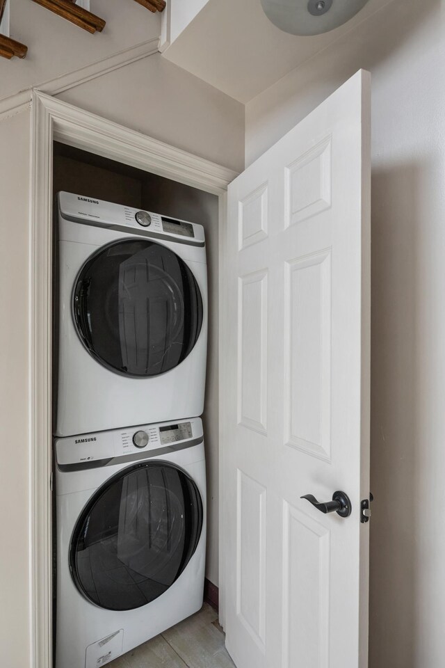 laundry area featuring stacked washer and clothes dryer