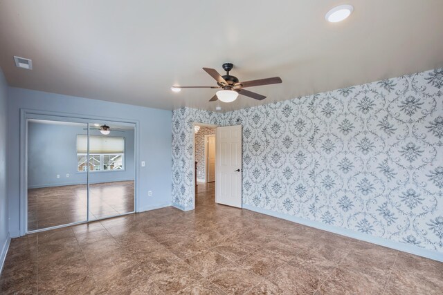 unfurnished room featuring ceiling fan