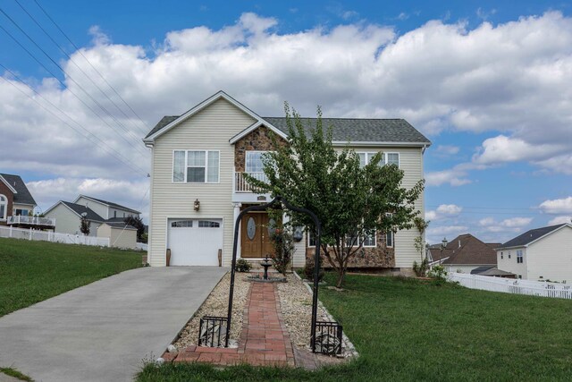 view of front facade with a garage, a balcony, and a front lawn