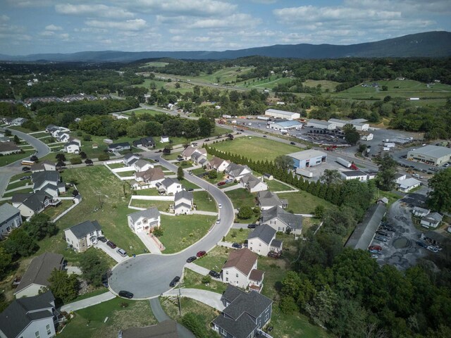 birds eye view of property featuring a mountain view