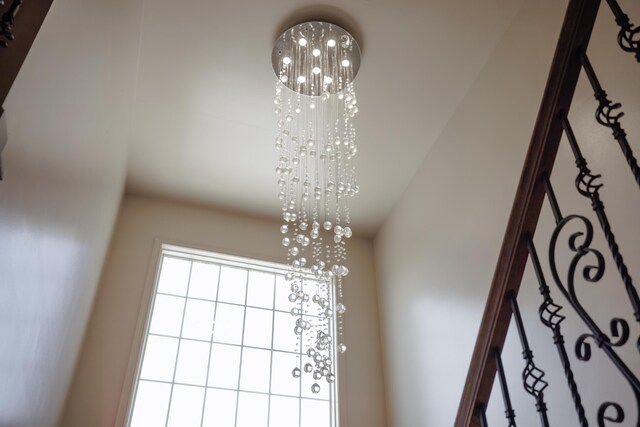 interior details featuring a notable chandelier