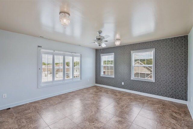 empty room featuring ceiling fan