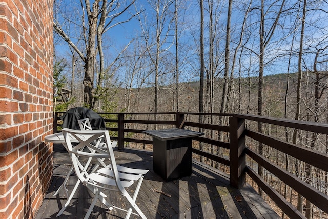 deck featuring a view of trees