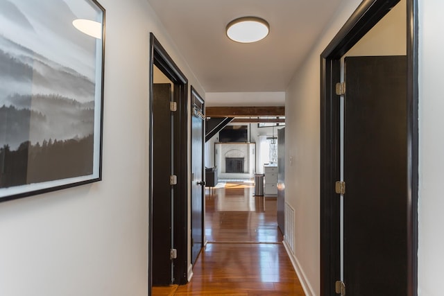 hallway with wood finished floors