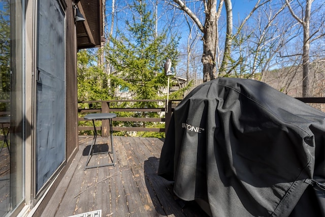 wooden deck with grilling area