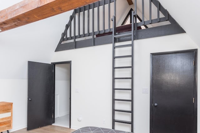 interior space featuring high vaulted ceiling and wood finished floors