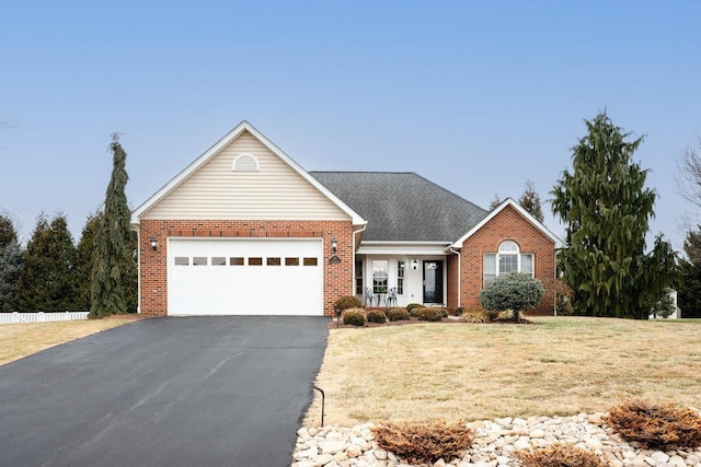 view of front of house with a garage, covered porch, and a front lawn