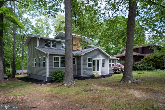 back of property featuring entry steps