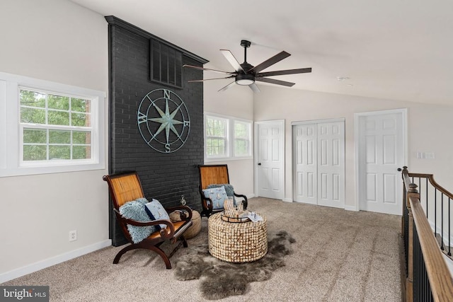 living area with carpet floors, a ceiling fan, baseboards, and high vaulted ceiling