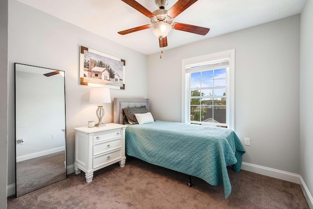 bedroom featuring baseboards, a ceiling fan, and carpet