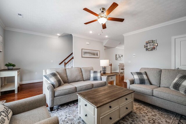 stairs with baseboards, recessed lighting, ornamental molding, and wood-type flooring