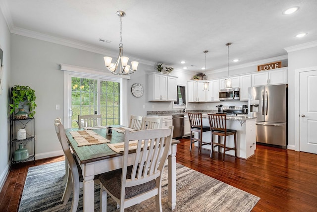 dining area with dark wood-type flooring, visible vents, crown molding, and a chandelier