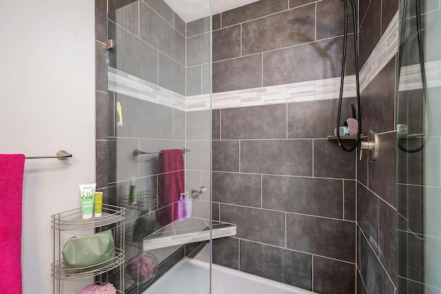 full bath featuring a tile shower
