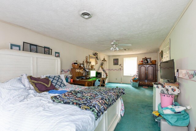 bedroom with ceiling fan, carpet flooring, and a textured ceiling