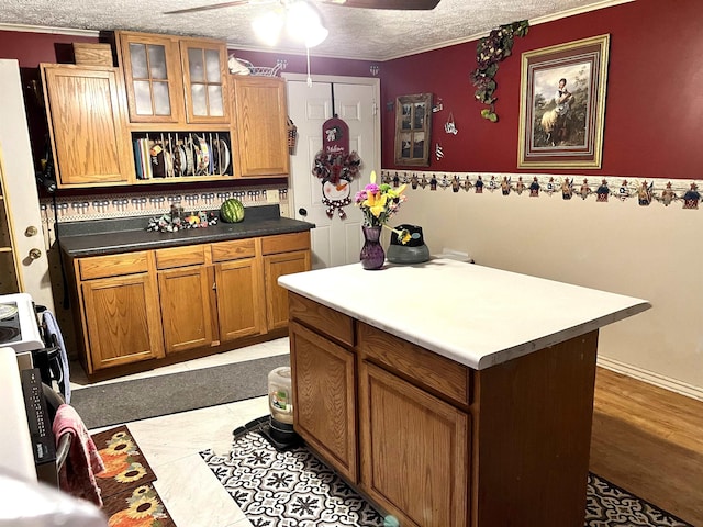 kitchen with ceiling fan and a textured ceiling