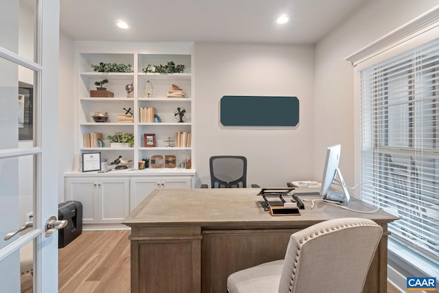 office with recessed lighting and light wood-style flooring