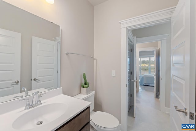 bathroom with toilet and vanity