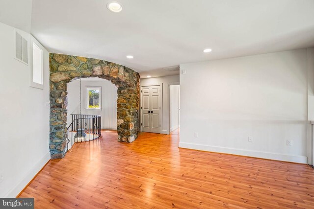 unfurnished living room featuring light hardwood / wood-style floors