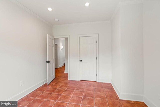 unfurnished bedroom featuring tile patterned floors and ornamental molding