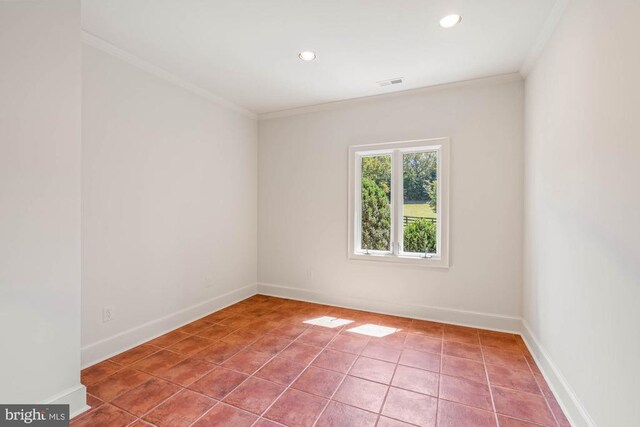 tiled empty room with crown molding