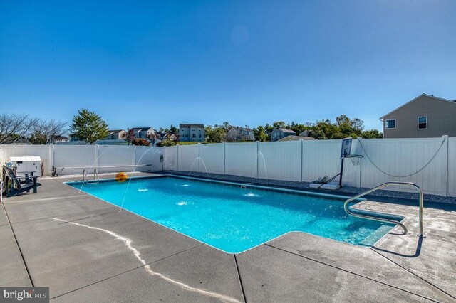 view of pool featuring a patio and pool water feature