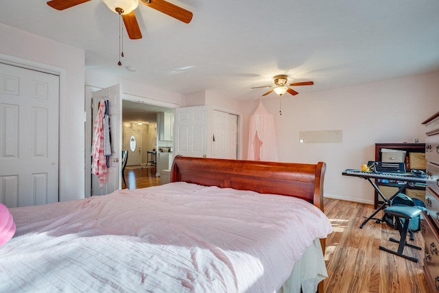 bedroom featuring ceiling fan and light hardwood / wood-style floors