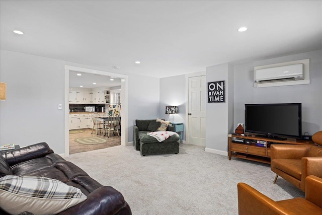 living area with recessed lighting, light colored carpet, baseboards, and a wall mounted AC