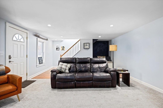 living room with baseboards, light colored carpet, and recessed lighting