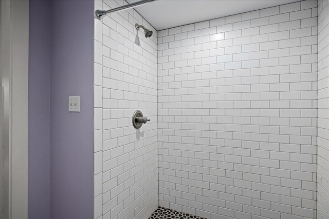 bathroom with a shower stall