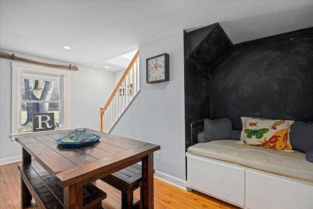 dining space featuring stairs, recessed lighting, wood finished floors, and baseboards