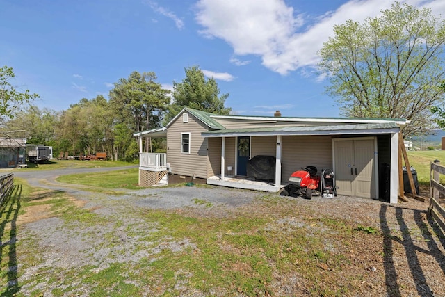 rear view of property with a yard