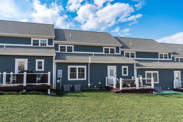 back of property featuring a lawn, central AC, and a wooden deck