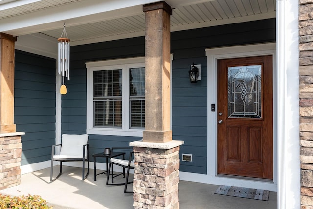 entrance to property with a porch