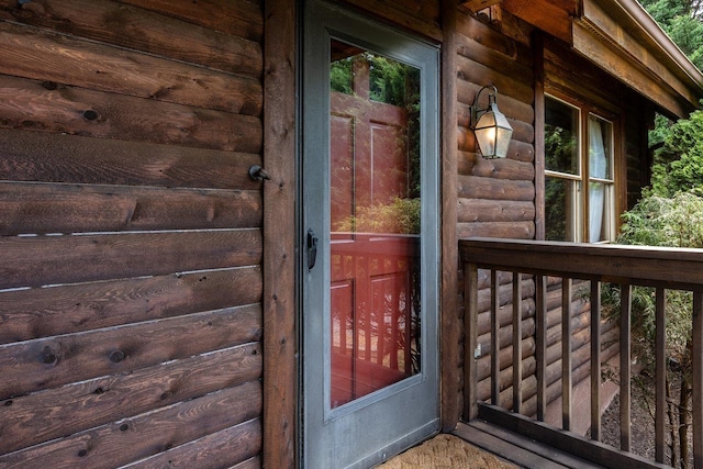 property entrance with a balcony