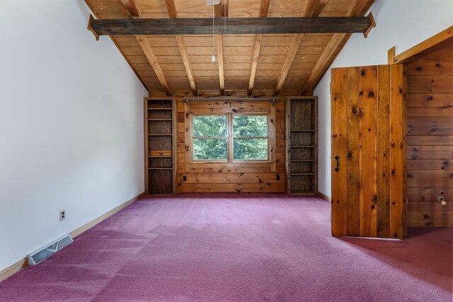 unfurnished living room featuring wood ceiling, wooden walls, lofted ceiling with beams, and carpet flooring