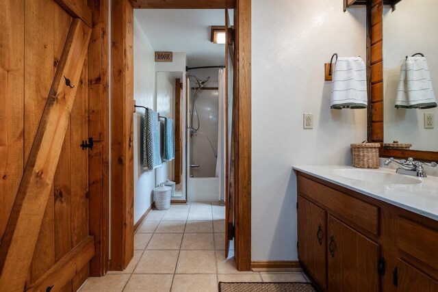 bathroom with vanity, bathtub / shower combination, and tile patterned floors