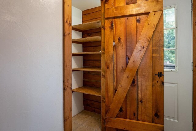 stairway with tile patterned flooring