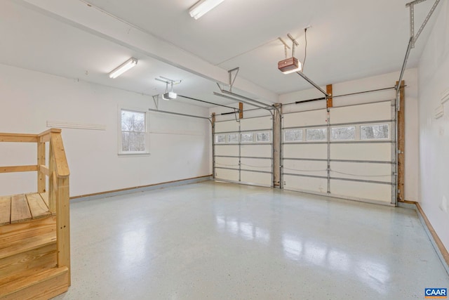 garage featuring baseboards and a garage door opener