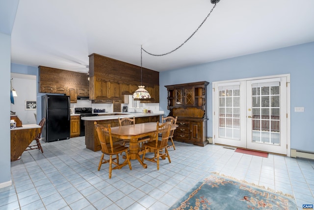 dining space with light tile patterned floors, french doors, baseboard heating, and visible vents