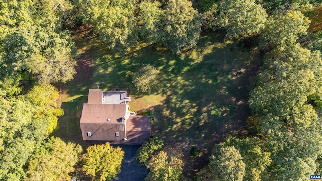 birds eye view of property with a wooded view