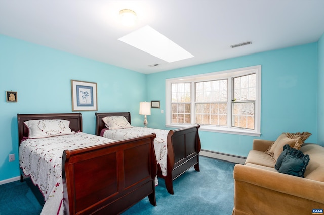 carpeted bedroom with a baseboard heating unit, visible vents, and a skylight