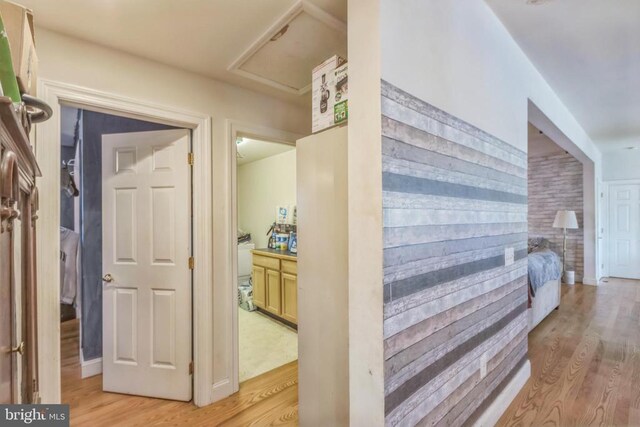 corridor with light wood finished floors