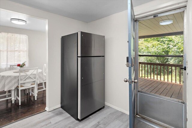 kitchen featuring stainless steel refrigerator and light wood-type flooring