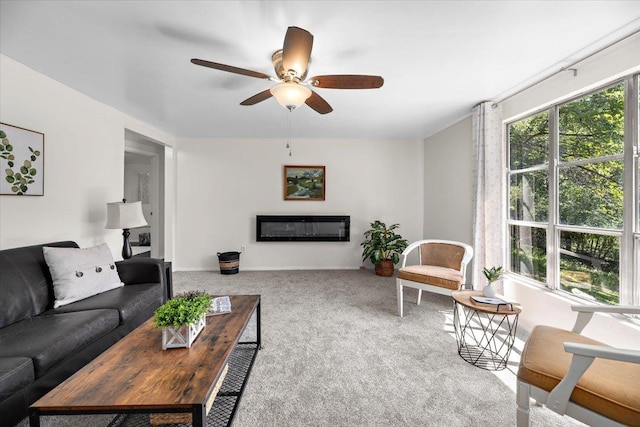 carpeted living room with ceiling fan