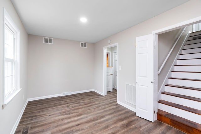 interior space with visible vents and wood finished floors